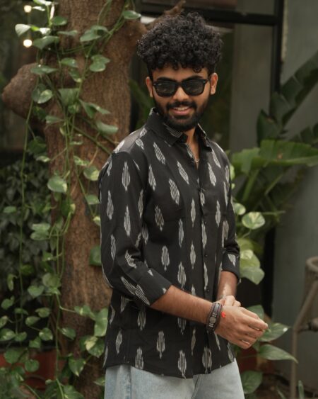 Three-quarter view of a model wearing the Black Single Ikat Shirt.