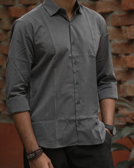 Close-up of collar, button front and slub fabric of a model wearing the Charcoal Slub Cotton Shirt.