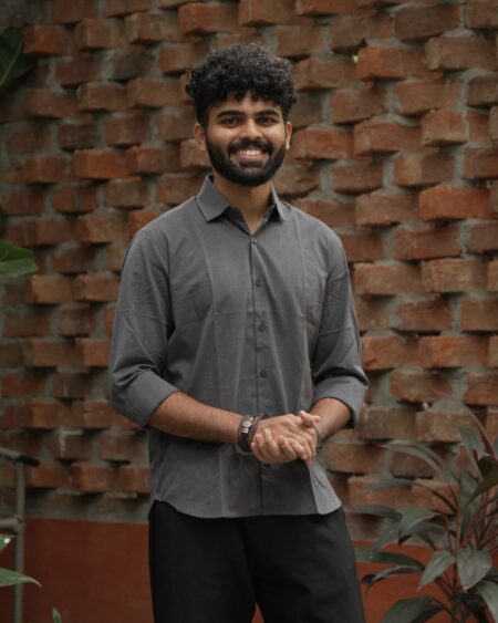 Front lifestyle view of a model wearing the Charcoal Slub Cotton Shirt.
