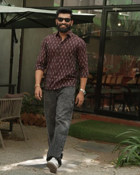 Walking front view of a model wearing the Cocoa Single Ikat Shirt.